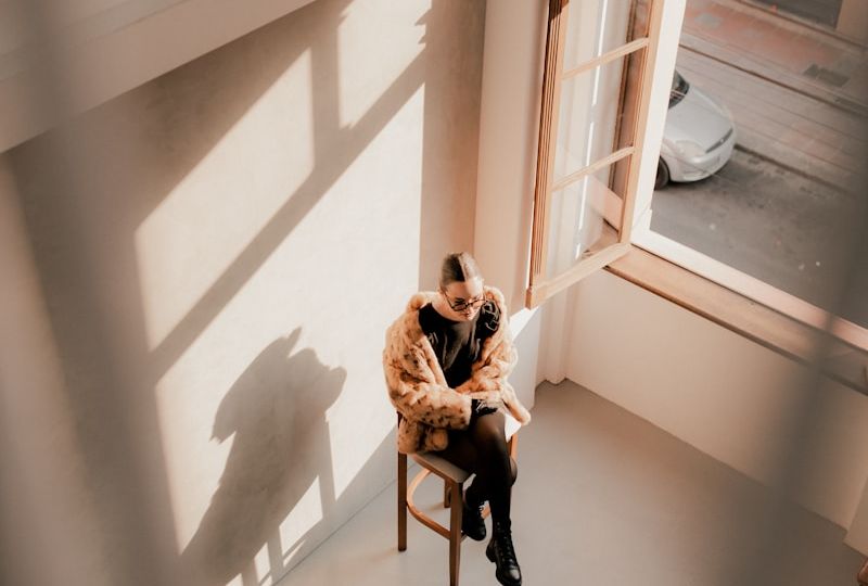 A person sitting in a chair in a room