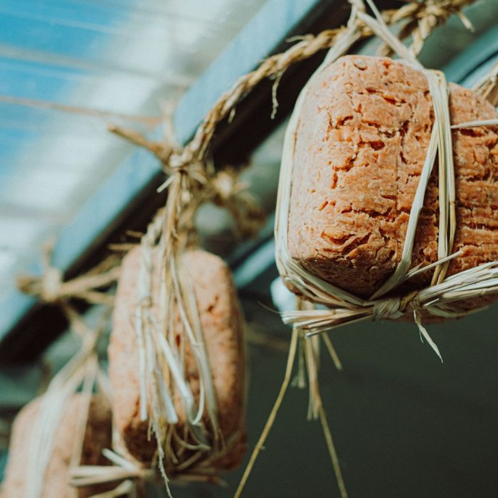 a bunch of bread hanging from a ceiling